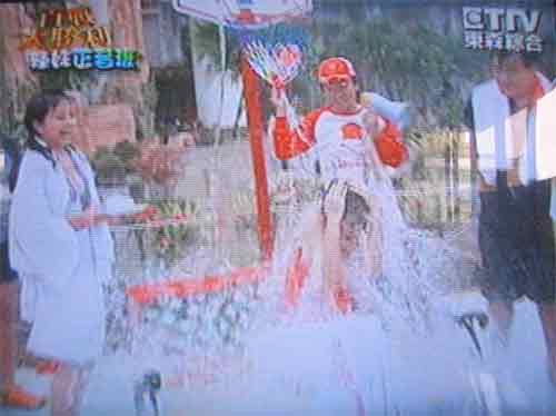 unsuccessful TV show contestant is doused with water
