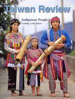 cover of Taiwan Review, featuring a man, woman, and child in traditional aboriginal (Amis) dress